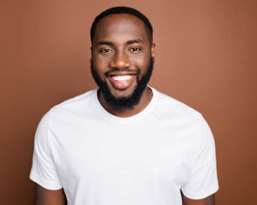 istockphoto-1204598583-612x612 Man wearing a white T-shirt with a healthy, radiant smile, laughing cheerfully.